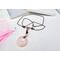 Boho style rose quartz necklace on brown leather cord with a stainless steel lobster clasp.