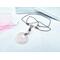 Boho style rose quartz necklace on brown leather cord with a stainless steel lobster clasp.