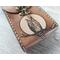 Premium Handmade Leather Tarot Card Case featuring a wise all-seeing owl patiently waiting on a branch in front of the full moon. This high quality leather case has a unique and interesting 3 color finish, with a natural tan moon set against a dark rich brown.