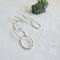 Fine silver triple hoop hammered finish dangle earrings with a sterling silver ear wire.