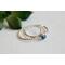 Denim lapis ring with beaded silver band on a wooden surface, showcasing eco-friendly craftsmanship.
