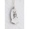Floral detail on the back of a ocean jasper pendant. 