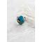 Sterling silver ring featuring chunky turquoise free form stone with silvery pyrite inclusions and a floral textured band.
