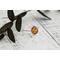 Pear shaped Baltic amber cabochon set on a textured organic band and bezel.
