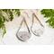 Trillion shaped sterling silver earrings stamped with a floral design hanging from sterling silver chain a French hook ear wire. 