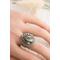 Sterling silver wide band ring will floral design, a morinci 2 turquoise pear shaped cabochon with pyrite inclusions and beaded accent bezel