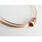 Three mixed metal bangles of sterling silver, 14K gold filled and copper with a copper spinner bead with sterling silver rings.