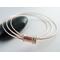 Three mixed metal bangles of sterling silver, 14K gold filled and copper with a copper spinner bead with sterling silver rings.