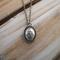 Handcrafted sterling silver lotus flower yoga necklace on wooden background, 16"-20" chain, unique gift design.
