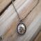 Handcrafted sterling silver lotus flower yoga necklace on wooden background, 16"-20" chain, unique gift design.
