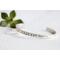 Sterling silver cuff bracelet stamped with Elle Est Forte.