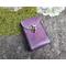Handmade Premium Leather Tarot Card Case in a purple hue called Violet Cosmos with black hand stitching. Shot outside in natural light.