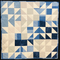 Blue, tan and white baby quilt
