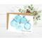 Card with light blue watercolor ornaments. There are five round globes.  With or without wording Seasons Greetings.