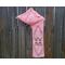 Another pic of a pink scarf with hearts along its length.