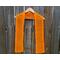 Orange Diagonal Crochet Scarf display on a hanger in front of a wooden fence.