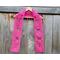 Pink Mom Crochet Scarf display on a hanger in front of a wooden fence.