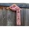 Another pic of a pink scarf with balloons along its length.