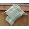A beige v stitch crochet scarf display.