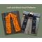 An orange scarf with leaves and a black scarf with ghosts.