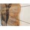 This shows the edge of the the deer wall art. The boards are left  rough and are layed out in a staggard, uneven pattern.