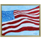 Colorful US Flag Art. This is an abstract flag that appears to be blowing in the wind. The flag is on a blue background and the art has a gold frame.