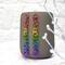 Chainmaille earrings in lgbtq rainbow pride colors hanging from a grey mug. Links are a single strand, with orbital rings.