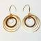 Madera Design Studio's Circles Earrings are a pair of unique, bold, dangle hoop earrings. Handmade in Philadelphia by a small local studio. 