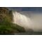 Niagara Falls from the base of the falls. showing the powerful water coming over the cliff above.