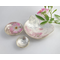 Set of three nesting trinket dishes made from a vintage silverplated brass serving tray. Largest dish is a bird shape, two smaller dishes are round. Photo shows all three side by side, one with tiny rose blossom floating in water.