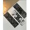 black and white floral bookmark set of 3 on a white table with a light brown table runner with fairy lights in a jar in the left-hand corner