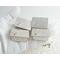 Photo shows four tiny silver hinge-lid trinket boxes with choice of 4mm gemstone cabochon, shown in gloved hand.