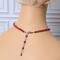 Red choker necklace on mannequin showing extender chain.