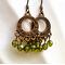 copper hoop earrings with green crystals