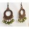Copper hoop earrings with peridot crystals