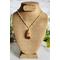 Dried Moss and Mushroom Gold Leaf Resin Pendant on Gold Colored Sterling Silver plated Copper Chain on Bust
