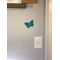 Teal acrylic butterfly on wall