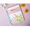 a blank notebook with turquoise lined paper that has a flower cover that says grow
