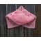 Another pic of a pink scarf with hearts along its length.
