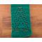 Close-up of a green scarf showing details of a tree in the pattern.