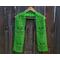 Display of the Tulip Crochet Scarf Pattern on a hanger in front of a wooden fence.