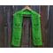 Display of the Tulip Crochet Scarf Pattern on a hanger in front of a wooden fence.