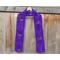 Purple scarf with hearts along the length. It is on a hanger in front of a wooden fence.