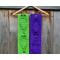 A pic of both the green and the purple scarves with balloons along their lengths.