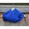 A blue vine crochet scarf display.