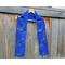 Display of the Dad Crochet Scarf on a hanger in front of a wooden fencer.