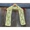 Display of the Diamond Crochet Scarf on a hanger in front of a wooden fence.
