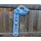 Another pic of a blue scarf with snowmen along its length.