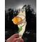 Ghost with pumpkin and lampwork leaf in direct sunlight.