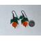 Pumpkin earrings in orange and green with coin to visualize size